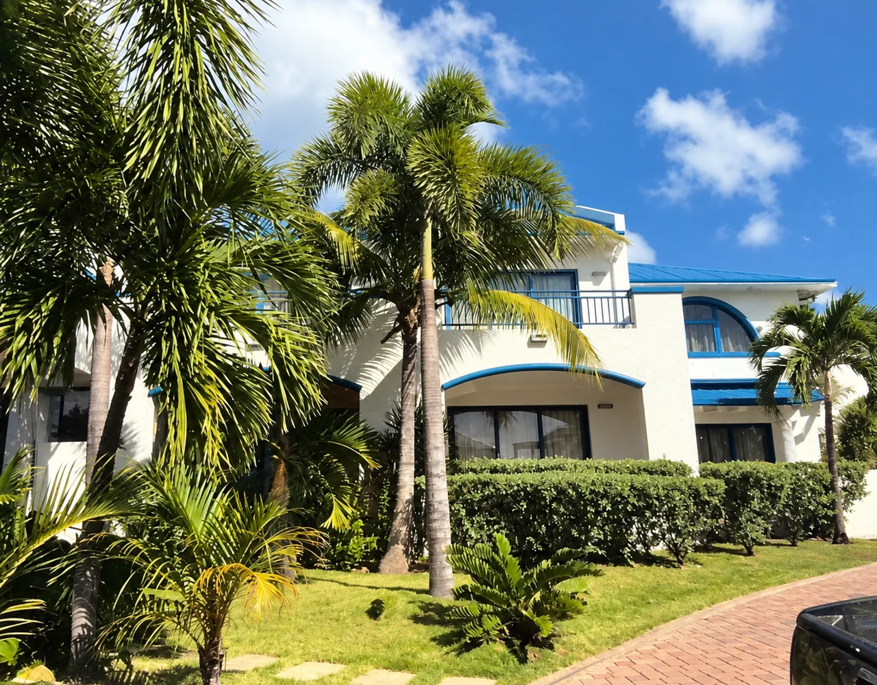 A property framed by mature planting and tropical light.